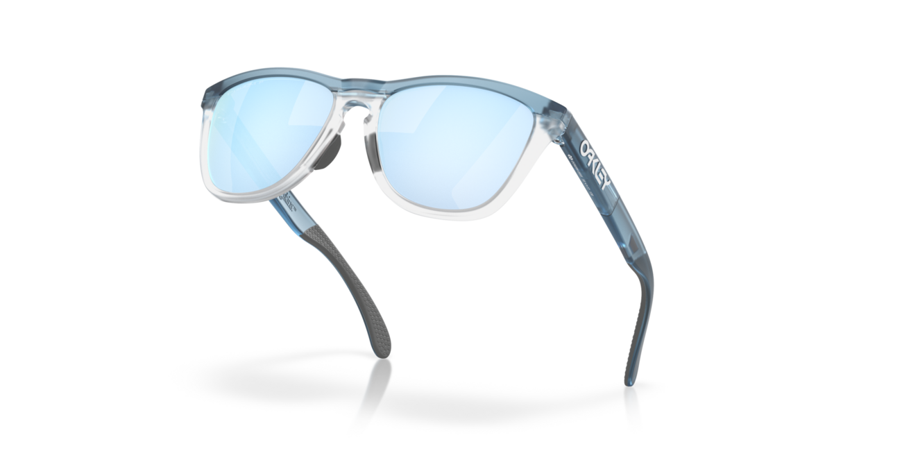 Oakley FROGSKINS RANGE слънчеви очила с рамка Trans каменно пране/прозрачен и со стъкла Prizm Deep Water Polarized, 55